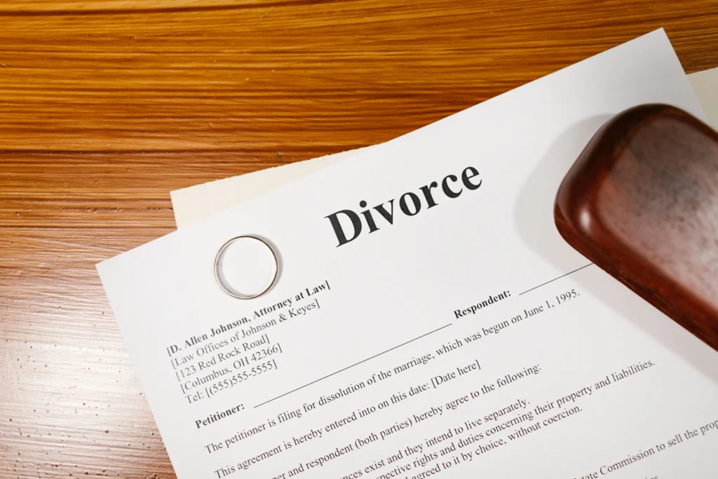 Divorce documents with a wedding ring and judge's gavel representing the Idaho divorce filing process.
